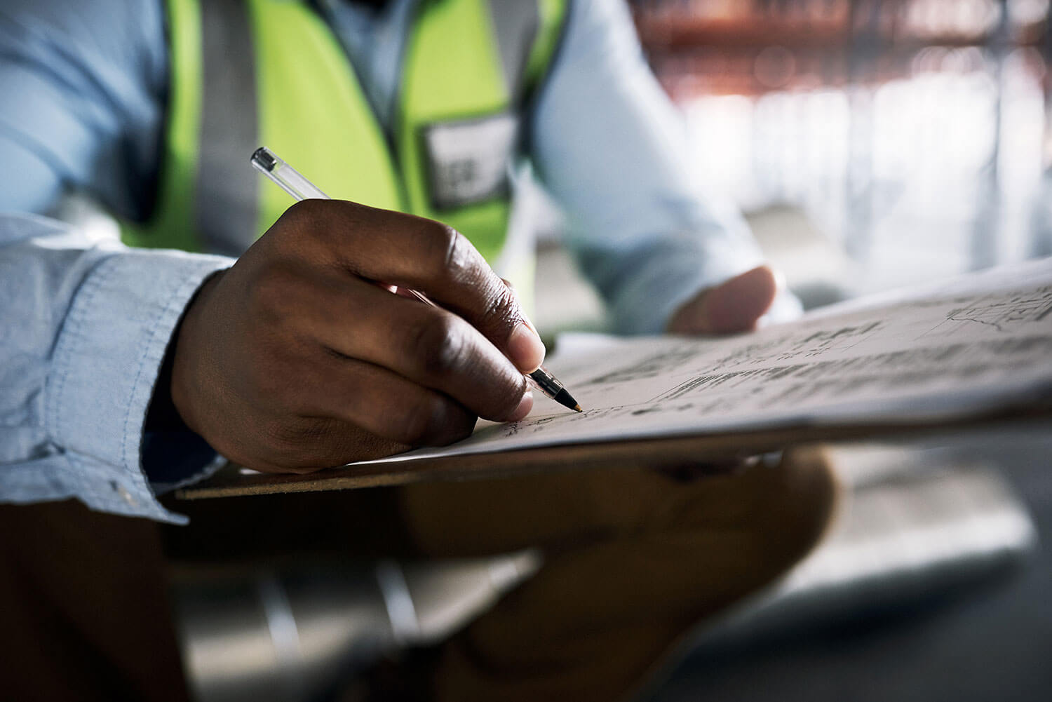 Man Going through a checklist to make sure the concrete supplier passes all their needs